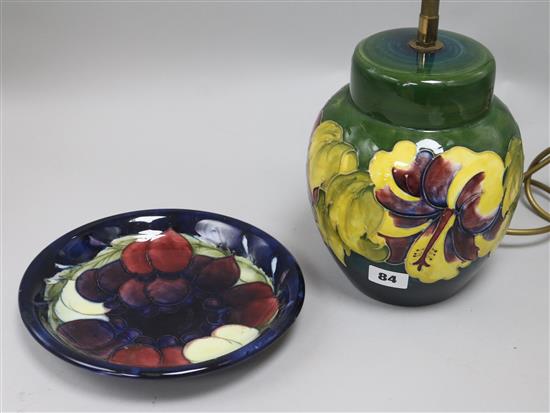 A Moorcroft table lamp and a plate